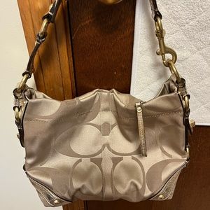 Pretty Coach medium sized gold bag/purse with signature logo.